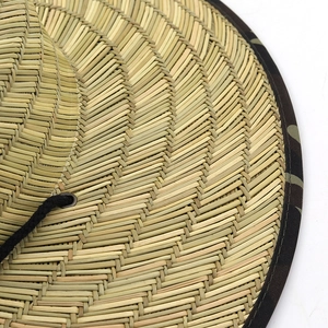 Outdoor straw sun hat with camouflage brim and adjustable chin strap for sun protection