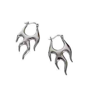 Detail showing the polished S925 sterling silver flame shaped earring's glossy finish