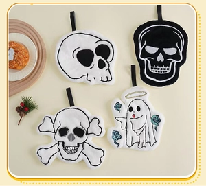 Detailed close-up of 4 Halloween coral fleece hand towels with embroidered skulls and ghost