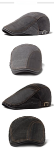Detail of vintage cotton flat cap with metal side buckles and distressed fabric texture