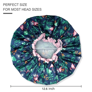 Detail showing elastic pink band and 12.6 inch diameter of flamingo print bath cap