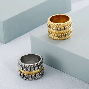 Wide mixed-metal stainless steel rings with hammered texture and sparkling rhinestones