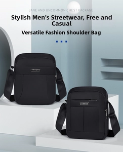 Detail view of water-resistant black crossbody bag showing textured fabric and metal logo