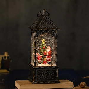 Vintage Christmas lantern music box with Santa snow globe and warm LED lighting effect