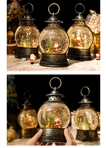 Close-up of vintage bronze Christmas snow globe lantern with Santa and tree inside