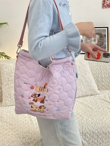Quilted lavender tote bag with cartoon puppy embroidery and pink adjustable strap