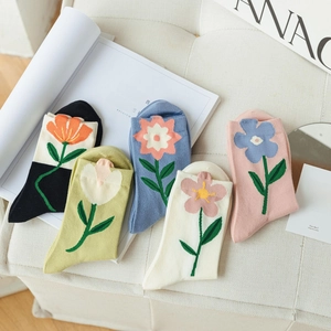 Five pairs of cotton crew socks with large floral patterns in assorted vibrant colors