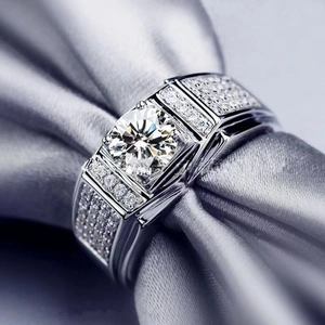 Luxury men's silver ring with a large round zircon center stone and pave diamond accents