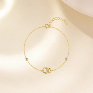Macro view of gold S925 sterling silver chain featuring interlocking rings and Luck engraving