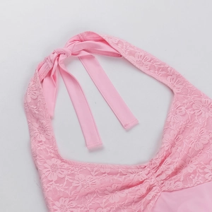 Close-up of pink lace halter top with detailed neck ties and delicate floral stitching
