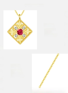 Detail of s925 silver gold-plated necklace featuring red zircon in window frame pendant
