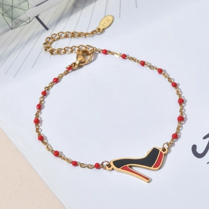 Bohemian stainless steel bracelet with red beads and a stylish high heel shoe charm