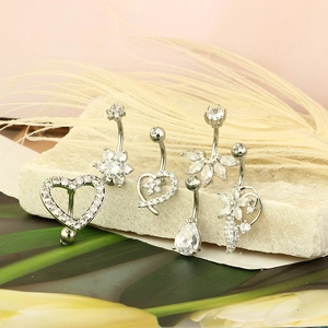 Five styles of stainless steel belly rings with sparkling cubic zirconia on stone base