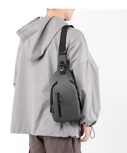 Rear view of a matte grey waterproof men chest bag with adjustable nylon strap and buckle