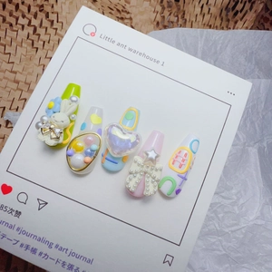 Detailed view of 5D embossed nail stickers featuring cute 3D bunnies and pearl bows