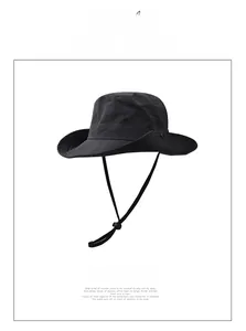 Close-up of black outdoor sun hat with reinforced brim stitching and adjustable chin strap