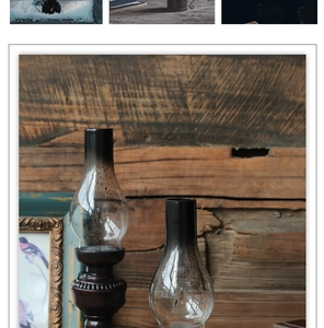 Macro shot of retro oil lamp featuring dark resin base and black gradient glass shade