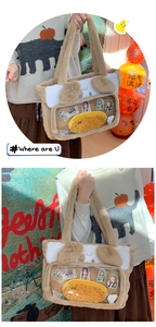 Macro detail of plush cat-ear tote bag featuring clear PVC window and fish charm