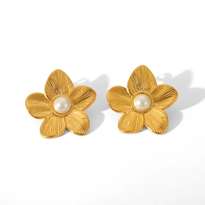 Detailed macro view of 18K gold plated flower stud earrings featuring white pearl centers