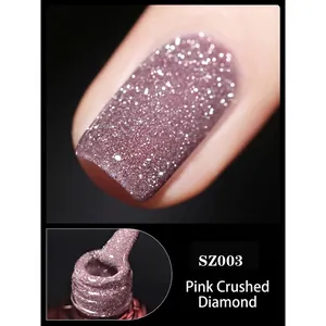 Macro detail of SZ003 pink glitter gel nail polish showing sparkle texture and applicator