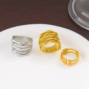 Three geometric hollow bone design stainless steel rings in silver and gold plating