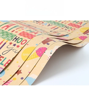Detail view of Happy Birthday kraft wrapping paper with colorful cartoon patterns