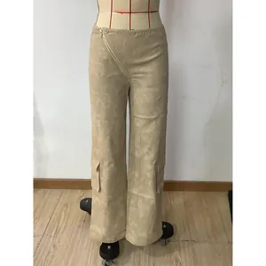 Detail of khaki cargo pants featuring large side pockets and diagonal zipper design