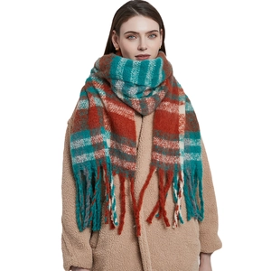 Thick plaid knit scarf for women with red and green patterns and decorative fringe
