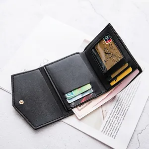 Women's black trifold wallet with multiple card slots and leather texture in a stylish setup