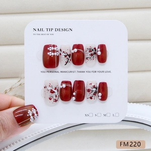 Chinese style burgundy cat-eye press-on nails with plum blossom art and pearl accents