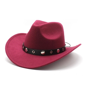 Detail of burgundy western cowboy hat with a studded black leather decorative band