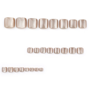 Set of champagne gold cat eye press-on toenails with metallic pearl finish and varied sizes