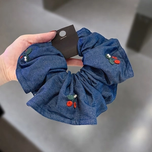 Navy blue denim scrunchie with embroidered cherries and white pearl accents