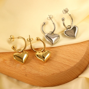 Minimalist heart charm hoop earrings in polished gold and silver finishes