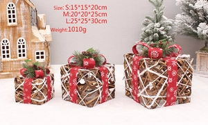 Detailed view of natural rattan Christmas gift boxes with red bows and pine cones