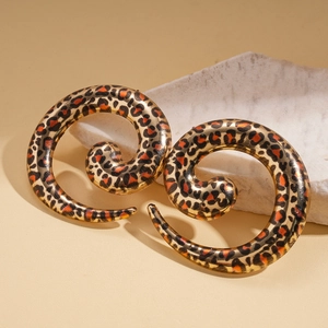 Curved leopard print spiral stud earrings with a polished finish and bold geometric style
