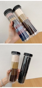 Detail of multi-color high elastic seamless hair ties stored in clear plastic tubes
