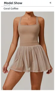 Detail of coral coffee layered mesh sports dress with square neck and built-in shorts