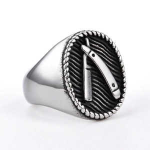 Vintage stainless steel signet ring for men with embossed straight razor design