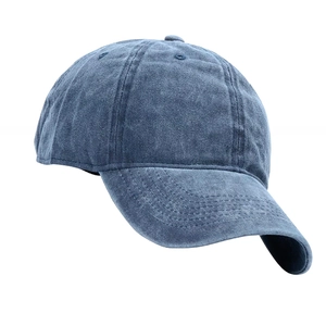 Detail view of washed denim blue baseball cap with 6-panel stitching and curved brim