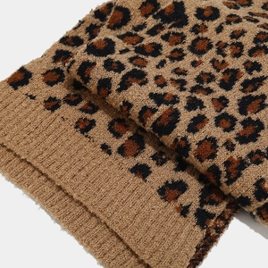 Close-up of thick leopard print knit scarf with ribbed edge and soft wool texture