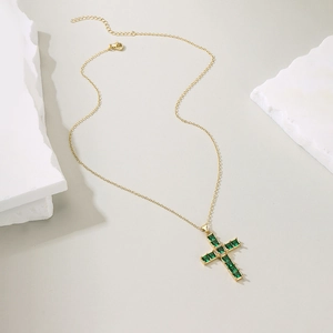 Minimalist gold-plated cross necklace with green zircon square stone on plaster block