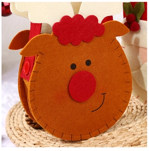 Close-up of reindeer felt Christmas gift bag showing texture and festive decorations