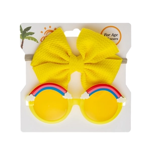 Detail of yellow bow headband and kids rainbow sunglasses on display card