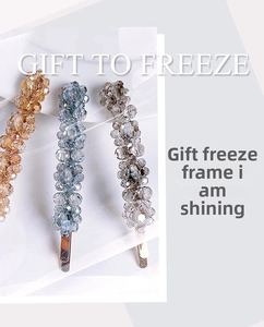 Detailed close-up of handmade beaded floral hair clips in champagne, blue and grey