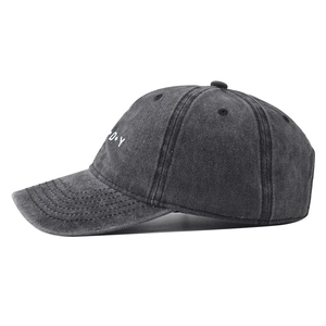 Detail of washed cotton baseball cap with white D.Y embroidery on side panel