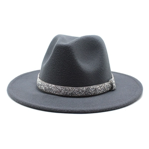 Close-up of dark grey wool felt fedora featuring a sparkling silver rhinestone hat band