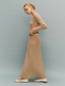 Detail of camel rib-knit long-sleeve dress with vertical stripe texture and slim fit