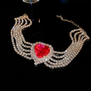Luxury multi-row rhinestone choker with a large pink heart crystal and fringe detail