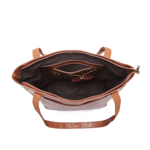 Vue détaillée de l'intérieur du grand cabas vintage marron avec fermeture éclair et poches